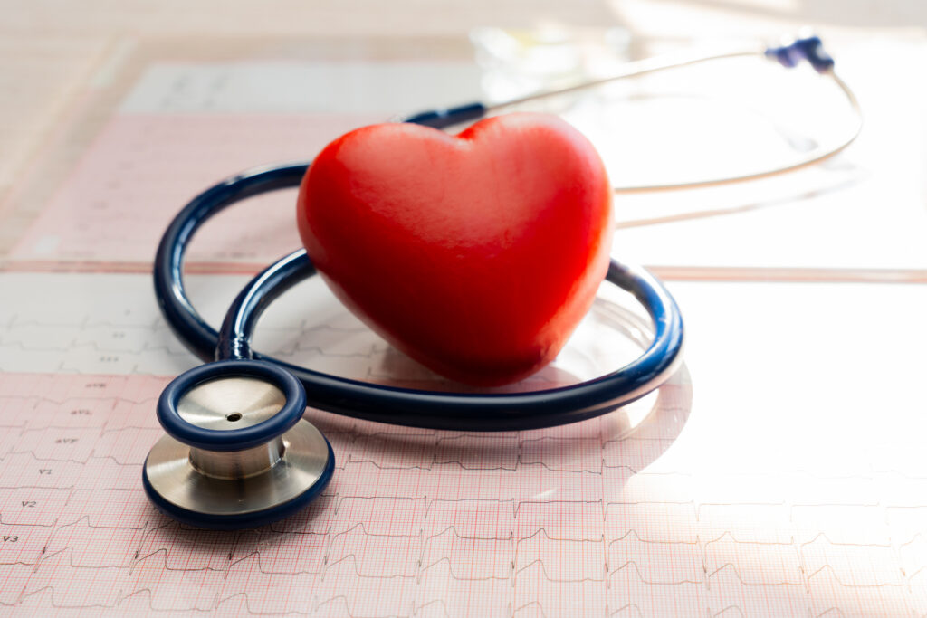 3D shaped heart, stethoscope and medical data